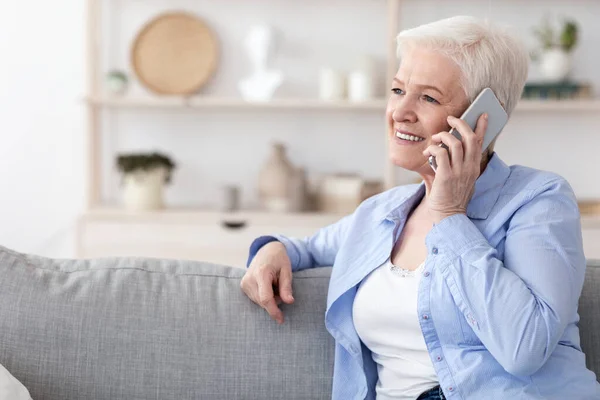 modern communication smiling elderly woman